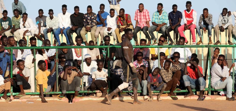 A wrestler prepares for a fight during a traditional Sudanese Nuba match in Khartoum on Friday, November 22. EPA