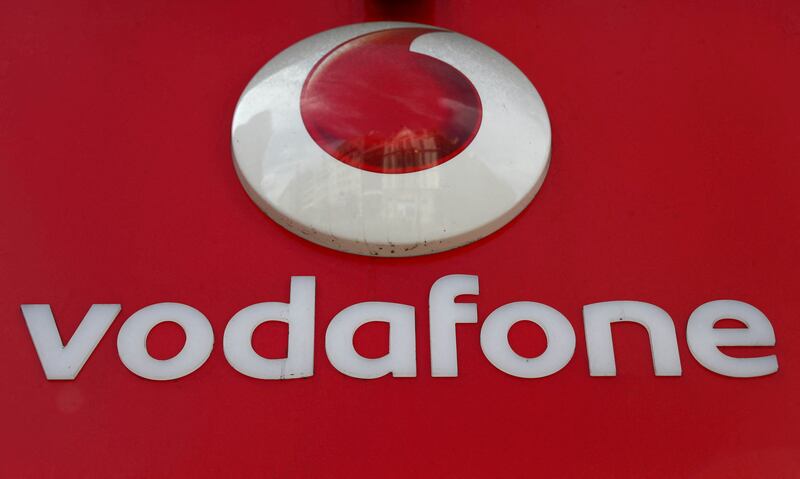 A branded sign is displayed on a Vodafone store in London. Reuters