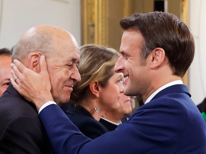 Former former foreign minister Jean-Yves Le Drian with French President Emmanuel Macron in 2022. Reuters