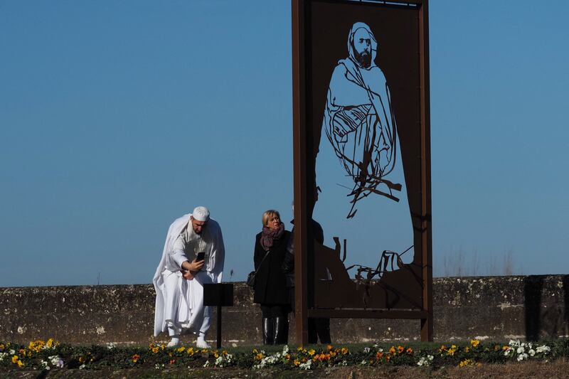 Paris mosque imam Tahar Cheir photographs a sculpture in tribute to Algerian national hero Emir Abdelkader by artist Michel Audiard, after it was vandalised prior to its inauguration in Amboise, central France. Photo: AFP