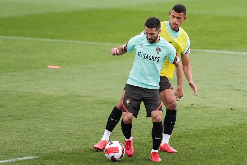 Portugal's Joao Moutinho, front, and Matheus Nunes. EPA