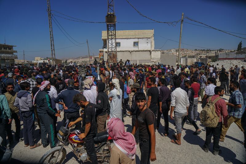 Syrians plead with local authorities to open the way for them to reach Turkey via the Bab al-Hawa border crossing. All photos: Moawia Atrash for The National