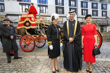 Mansoor Abulhoul following his visit with Her Majesty The Queen at Buckingham Palace for the presentation of diplomatic credentials, November 2019. Seen here with his wife in red, Victoria Devin, and the deputy Marshal of the Diplomatic Corps.