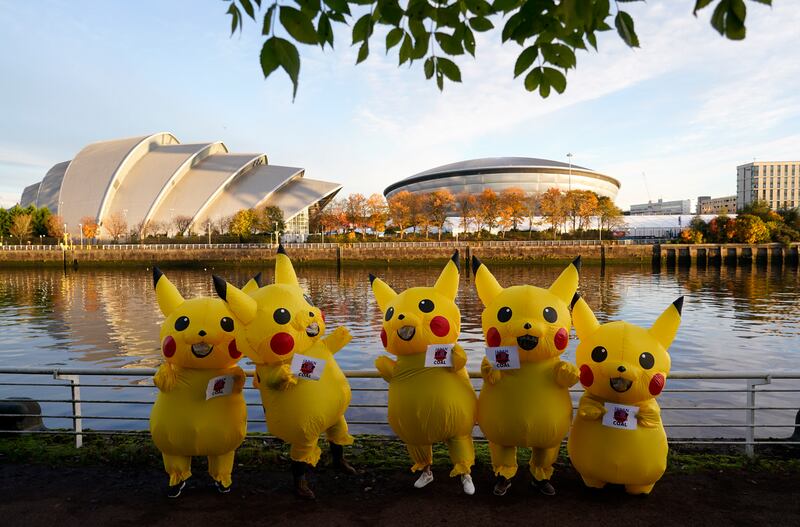 Activists dressed as Pokemon character Pikachu protest near the Cop26 summit venue in Glasgow against Japan's use of coal. AP Photo