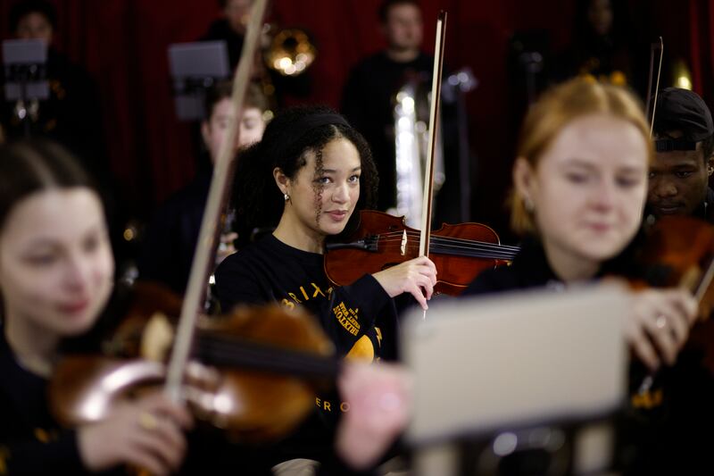Violinist Adrianna Forbes-Dorant, 17, takes part in a rehearsal with the Brixton Chamber Orchestra for coronation performances in London. AP