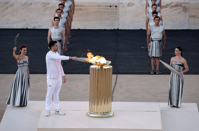 Water Polo athlete Ioannis Fountoulis lights the cauldron. Reuters