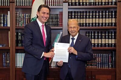 Lebanon's President Michel Aoun with Amos Hochstein in Beirut last week with a document linked to the maritime border agreement that Lebanon and Israel signed. AFP