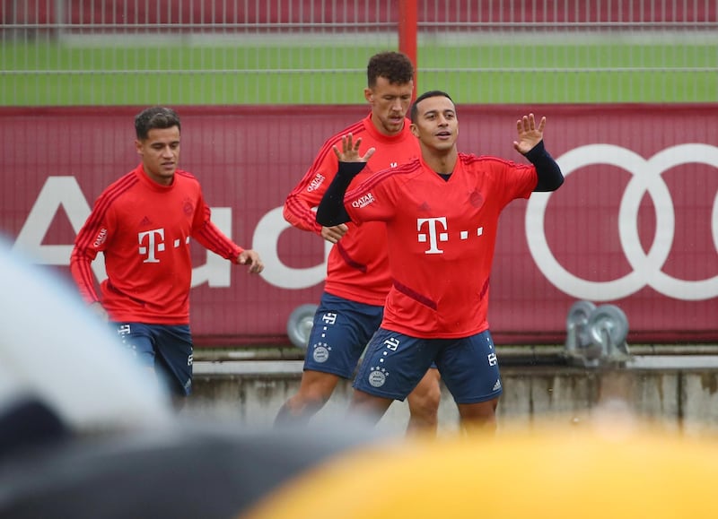 Thiago, Ivan Perisic and  Coutinho during training. Reuters