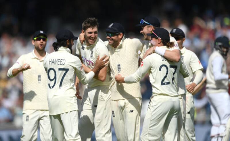 England bowler Craig Overton (is mobbed by teammates after taking the final wicket of Mohammed Siraj to seal victory over India in the third Test by an innings and 76 runs on Saturday, August 28. Getty
