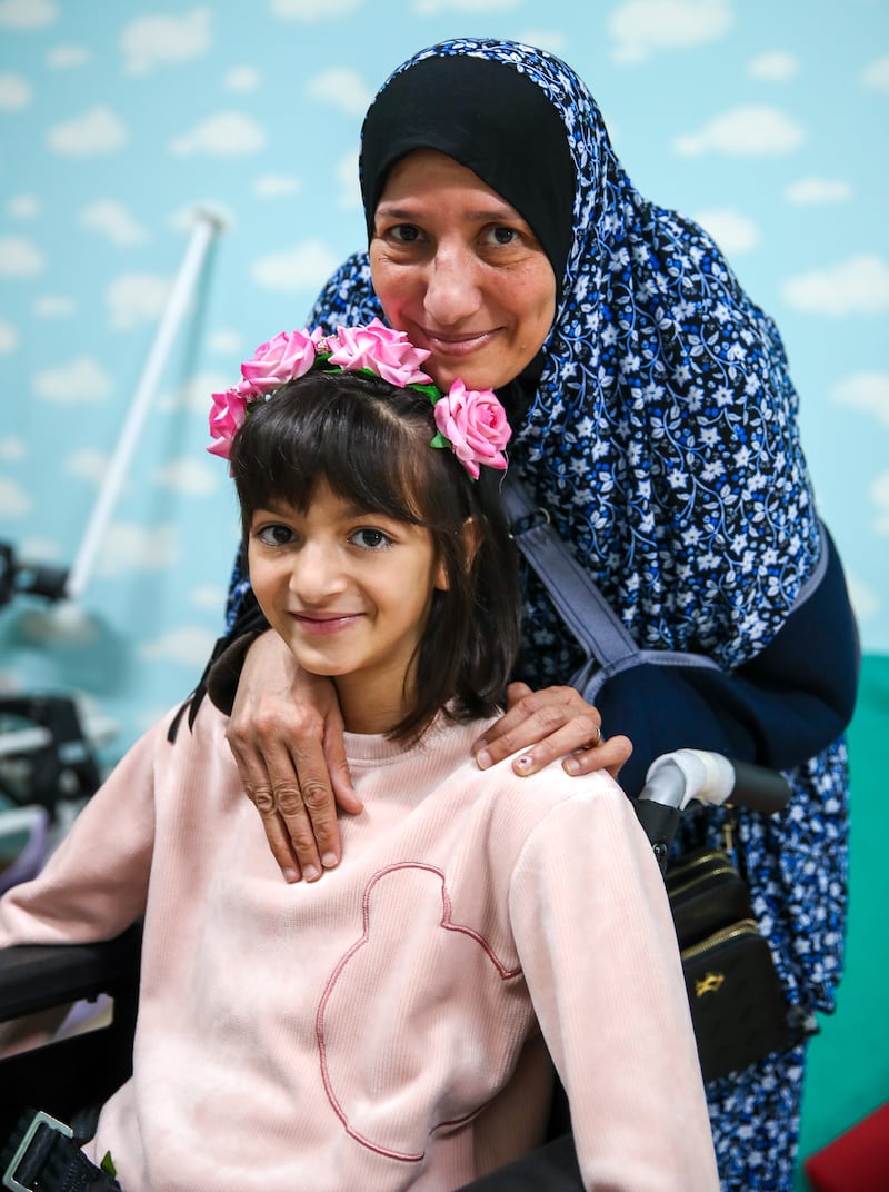 Lama Mady with her mother Sabine after being checked by doctors at Emirates Humanitarian City in Abu Dhabi