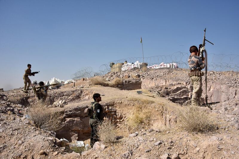 Security forces take part in an ongoing operation against Taliban militants in Sarkari Bagh in Arghandad district of Kandahar province on November 2, 2020. (Photo by JAVED TANVEER / AFP)