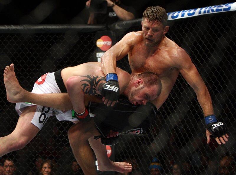 Nick Catone, left, taking down Tom Watson during their middleweight fight on Saturday. Catone won by split decision. Tim Larsen / AP 