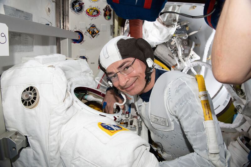 US astronaut Mark Vande Hei inspects a spacesuit in preparation for a spacewalk at the International Space Station, in August last year. Photo: Nasa