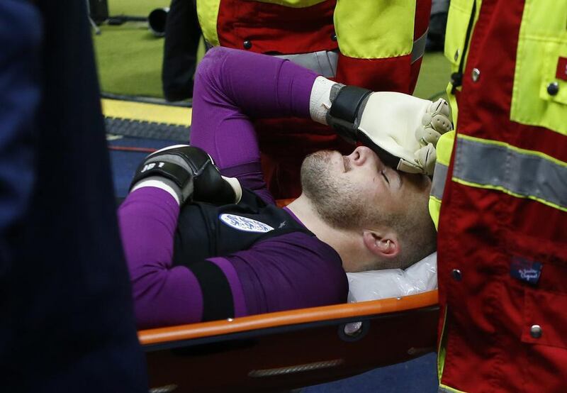 England’s Jack Butland looks dejected as he is stretchered off after sustaining an injury. Reuters / Fabrizio Bensch