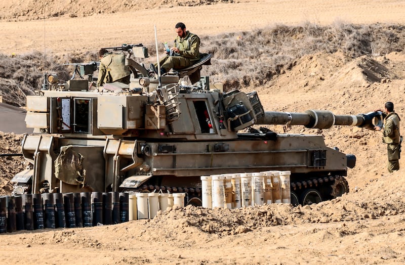 Israeli soldiers gather at an undisclosed location near the border with Gaza. EPA