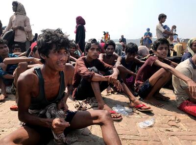 Rohingya refugees react after being rescued in Teknaf near Cox's Bazar, Bangladesh, Thursday, April 16, 2020. Bangladesh's coast guard has rescued 382 starving Rohingya refugees who had been drifting at sea for weeks after failing to reach Malaysia, officials said Thursday. (AP Photo/Suzauddin Rubel)