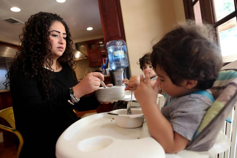 Diabetes sufferer Noor Al Ramahi, 28, with her sons Rakan and Kareem, admits to a lifelong struggle for health and recognises the problems the condition exacerbated. She says she has an understanding of diabetes that comes with maturity. Sammy Dallal for The National
