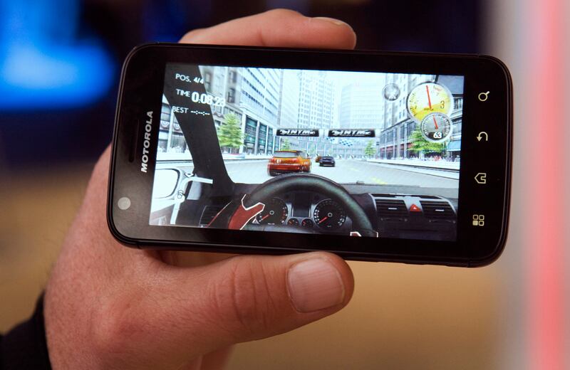 A racing game on an Android-based Motorola Atrix smartphone in Las Vegas, January 6, 2011. Reuters