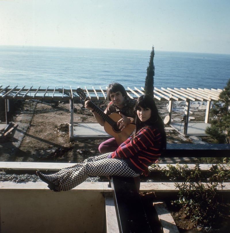 Salvatore Bono (1935 - 1998) and Cherilyn Sarkasian LaPier, better known as the husband and wife duo, Sonny and Cher, at their home in California, circa 1966. (Photo by Keystone/Hulton Archive/Getty Images)