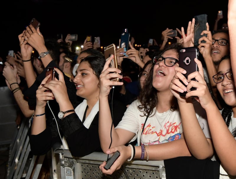 Fans film and wave during the Jeddah World Fest. AP Photo