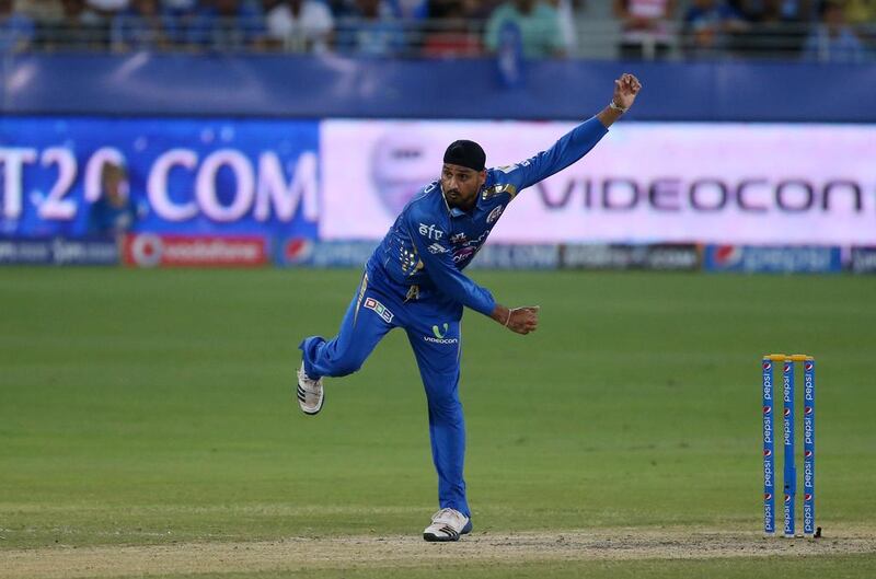 Harbhajan Singh of Mumbai Indians bowling against Sunrisers Hyderabad in Dubai on Wednesday. Singh held Sunrisers to 16 runs in four overs. Pawan Singh / The National / April 30, 2014