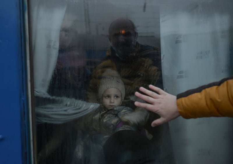 A father says goodbye to his daughter on an evacuation train about to leave Odesa in March 2022. AFP