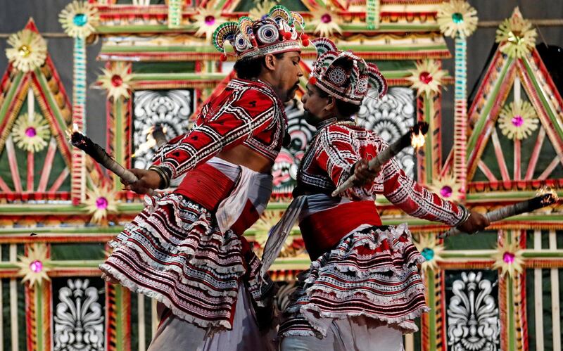 Traditional dancers perform during a healing ritual performance to invoke the blessings of the gods in the village of Hirana, near Colombo, Sri Lanka. Reuters