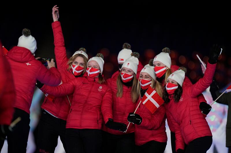 Athletes from Denmark pose for a photo during the closing ceremony. AP