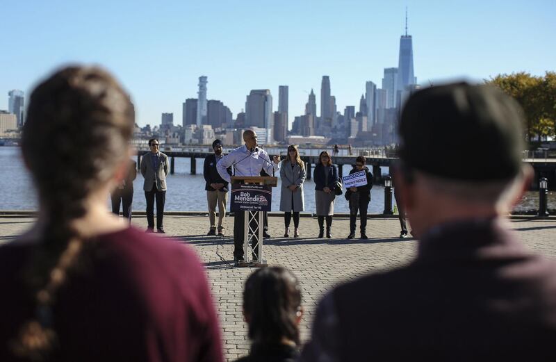 With the lower Manhattan skyline in the background, Senator Cory Booker speaks during a rally in support of Senator Bob Menendez in Hoboken, New Jersey. AFP