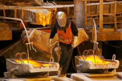 A worker negotiates his way amid the melting pots of copper at the foundry of the Chuquicamata copper mine in the desert town of Calama, 1,000km north of Santiago, Chile. 