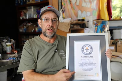 Ed Currie with his Guinness Book of World Records certification. AP