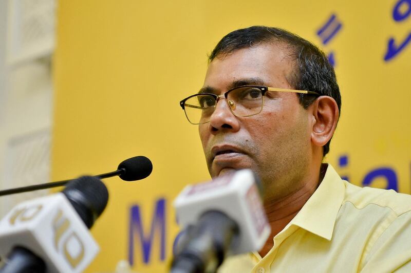 In this photo taken on October 17, 2019, former Maldives president Mohamed Nasheed, the current legislative speaker and majority leader, meets with members of his ruling Maldives Democratic Party (MDP) to ask for their support for a second term as party president in Male. (Photo by AHMED SHURAU / AFP)