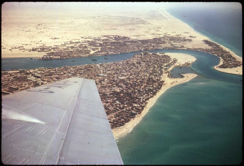 An aerial view of Dubai Creek in the early 1960s. Under the wing is Deira, across the water is Bur Dubai and to the right is Al Shindagha. All photos: David Riley © UAE National Library and Archives