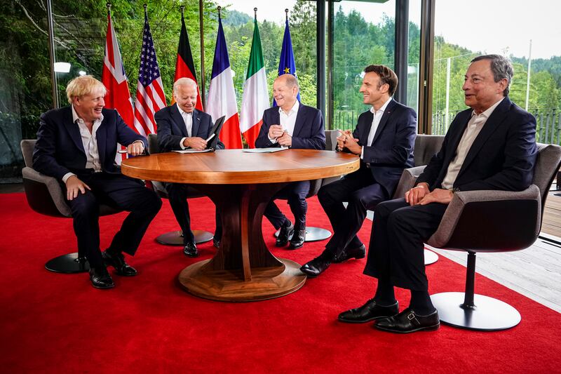 Britain's Prime Minister Boris Johnson, US President Joe Biden, German Chancellor Olaf Scholz, France's President Emmanuel Macron and Italian Prime Minister Mario Draghi chat before their meeting at Elmau Castle on Tuesday morning. Getty Images