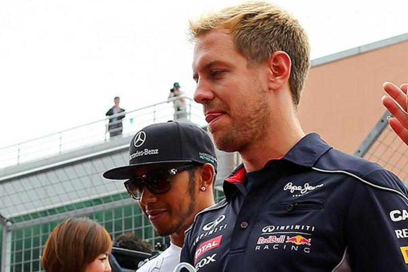 Lewis Hamilton, left, is fourth in the Divers' Championship standings with 161 points, 111 points behind leader Sebastien Vettel, right. Srdjan Suki / EPA