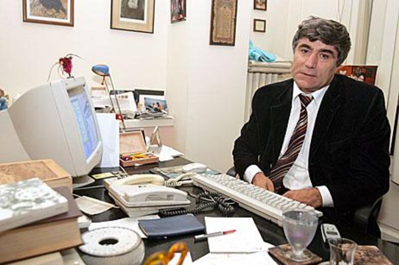 Hrant Dink, an ethnic Armenian Turkish journalist, poses at his office in Istanbul in October 2005. He sparked fury among Turkish nationalists after writing an article calling the killing of Armenians under the Ottoman Empire genocide. He was assassinated in January 2007.