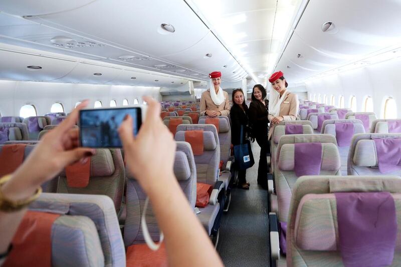 People tour an Emirates airline Airbus A380-800 during the Dubai Air Show. Christopher Pike / The National