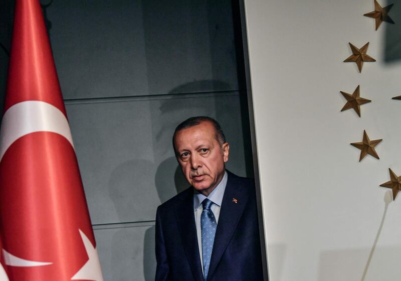 Turkish President Recep Tayyip Erdogan arrives to deliver a speech on June 24, 2018 in Istanbul, after initial results of Turkey's presidential and parliamentary elections.  Erdogan on June 24 declared victory in a tightly-contested presidential election, extending his 15-year grip on power in the face of a revitalised opposition. Turkish voters had for the first time cast ballots for both president and parliament in the snap polls, with Erdogan looking for a first round knockout and an overall majority for his ruling Justice and Development Party (AKP). / AFP / BULENT KILIC
