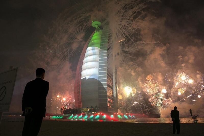 The dazzling 15-minute fireworks were accompanied by a sound and light show that was beamed on the sail-facade of the Burj. The scale of the display had beachgoers and residents stop to take photographs and video clips. Silvia Razgova / The National