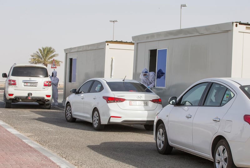 Dubai, United Arab Emirates - A passenger inside the car being tested by pricking blood sample before entering the Abu Dhabi at the new DPI Testing Centres border of Dubai and Abu Dhabi.  Leslie Pableo for The National for Shireena Al Nowais story