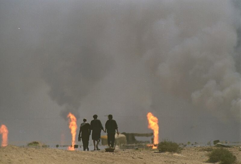 Three Kuwaiti refugees head toward Kuwait City from the Iraqi border in March 1991. The Iraqi invasion of Kuwait – 25 years ago next week - created conditions that ISIL capitalised on, writes Faisal Al Yafai (AP Photo/David Longstreath)