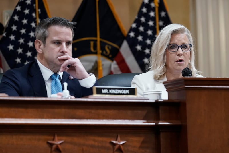 Adam Kinzinger, left, listens as vice Chair Liz Cheney, speaks as the House select committee investigating the Jan 6 attack on the US Capitol holds a hearing at the Capitol in Washington, on July 21. AP