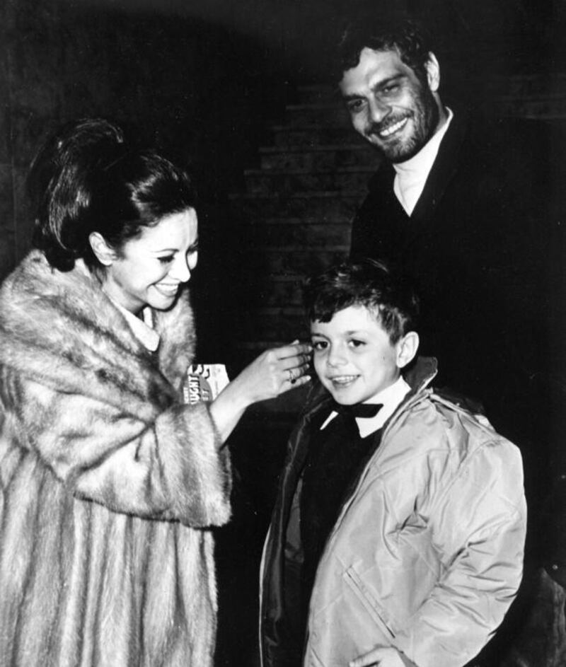 Egyptian actor Omar Sharif is seen with his wife, actress Faten Hamama, and their eight-year-old son, Tarek, as they get together for New Year’s Eve celebration in Madrid, Spain, on December 31, 1965. AP
