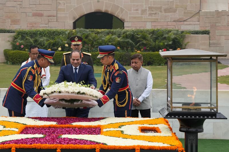 Mr El Sisi places a wreath at the Mahatma Gandhi memorial at Rajghat. AFP