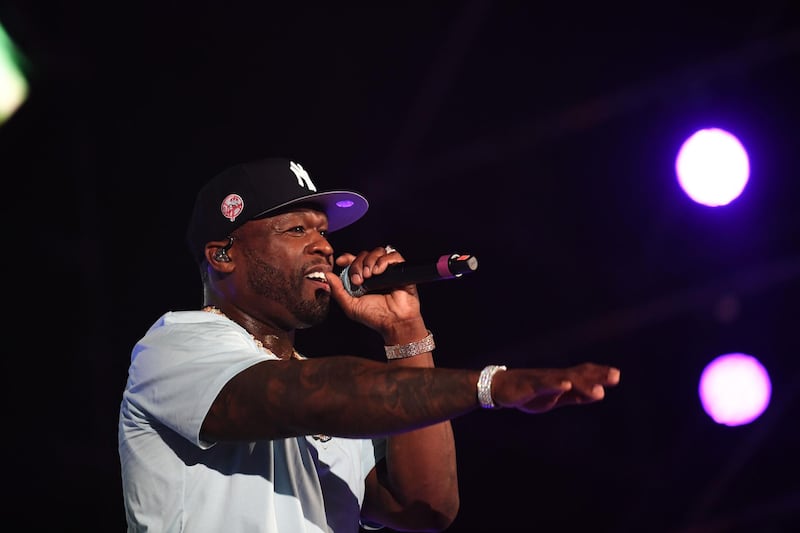 US rapper 50 Cent performs on stage during the Jeddah World music Festival on July 18, 2019, at the King Abdullah Sports City in the coastal city of Jeddah. US Pop icon Janet Jackson and US rapper 50 Cent are among musicians set to perform in Saudi Arabia, organisers said, after US rapper Nicki Minaj pulled out in a show of support for women's rights. / AFP / AMER HILABI
