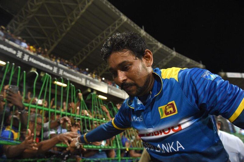 Sri Lanka's Tillakaratne Dilshan acknowledges the crowd at the end of the last match of his career, played in the second Twenty20 cricket match against Australia at the R. Premadasa Cricket Stadium in Colombo on September 9, 2016. Ishara S Kodikara / AFP