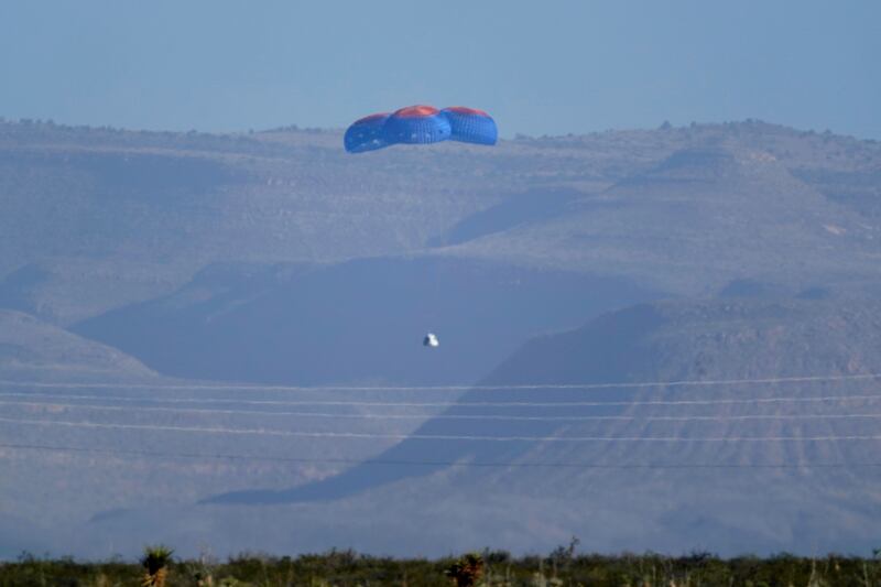 Parachutes carrying Blue Origin's capsule with passengers William Shatner, Chris Boshuizen, Audrey Powers and Glen de Vries going down to the spaceport near Van Horn, Texas, last October. AP