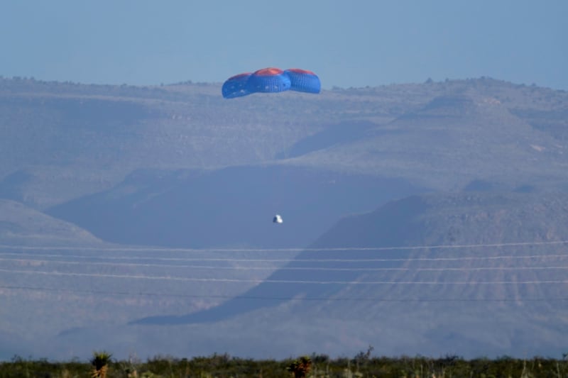 Parachutes carrying Blue Origin's capsule with passengers William Shatner, Chris Boshuizen, Audrey Powers and Glen de Vries going down to the spaceport near Van Horn, Texas, last October. AP