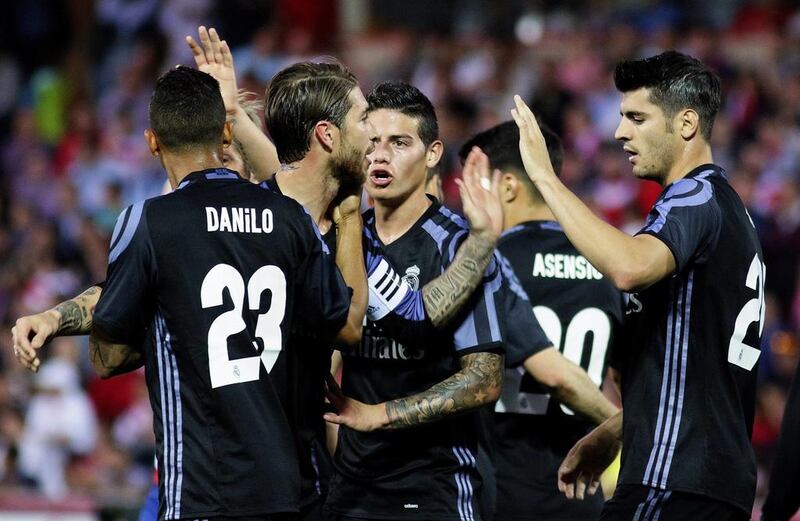 Real Madrid’s Alvaro Morata, right, celebrates with his teammates. Pepe Torres / EPA