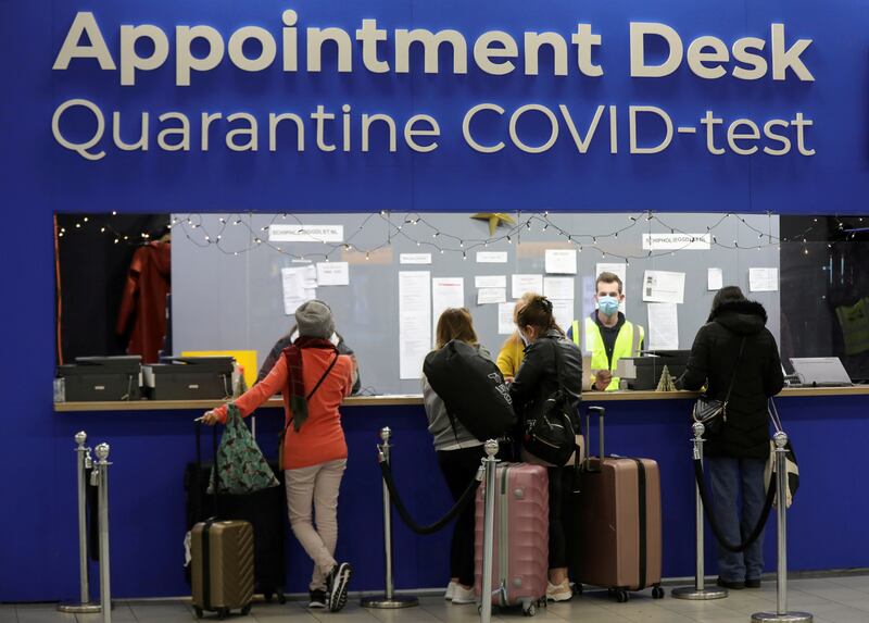 Passengers wait for quarantine and Covid-19 test appointments at Schiphol Airport, Amsterdam. Reuters